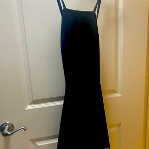 Elizabeth James Black Cocktail dress with laser cutouts on bottom.